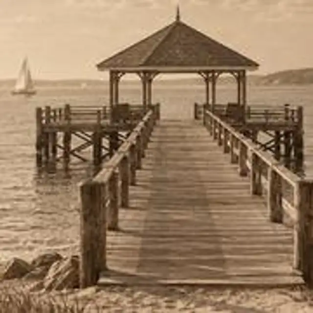 A small old black and white photo of a harbour with fishing boats