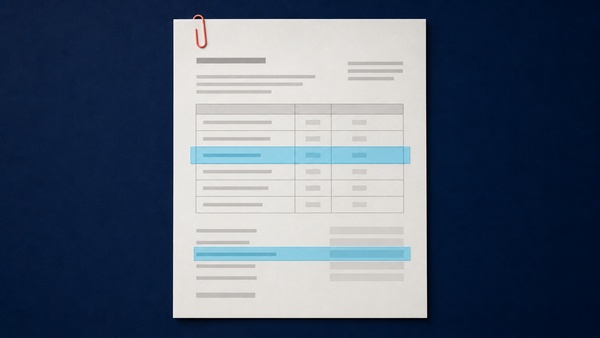 Business document with cyan layout highlights on a navy desk